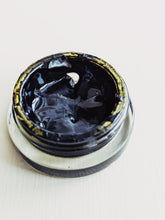 Load image into Gallery viewer, Patchouli Soliflore. natural perfume. chocolate foil wrapper, menthol, dinosaur dirt, tobacco, prehistoric mist, tar, swamp, paper, bittersweet cacao, root beer. August 2023