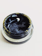 Load image into Gallery viewer, Patchouli Soliflore. natural perfume. chocolate foil wrapper, menthol, dinosaur dirt, tobacco, prehistoric mist, tar, swamp, paper, bittersweet cacao, root beer. August 2023