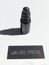 Load image into Gallery viewer, Patchouli Soliflore. natural perfume. chocolate foil wrapper, menthol, dinosaur dirt, tobacco, prehistoric mist, tar, swamp, paper, bittersweet cacao, root beer. August 2023