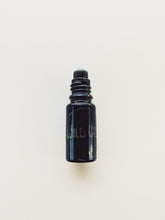 Load image into Gallery viewer, Violet Santal. natural perfume. unabashed sandalwood smoothed by violet leaves. July 2025