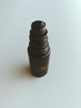 Load image into Gallery viewer, Witch. natural perfume. smoky amber with flecks of iron, ash, metal alloys, and straw. October 2022